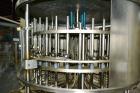 Used US Bottlers VA-32 Rotary Vacuum Filler chassis, not equipped with nozzles or change parts. SELLING PRICE AS IS, WHERE IS, SANFORD, NC.