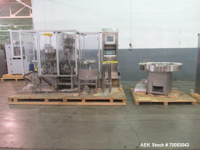 Used Used TL Bosch vial filling line, model MLF3002 filler, with 48" diameter accumulation table, vial air cleaner station, 4 head filling station, stopper inserter and capper stations with bowl feed...