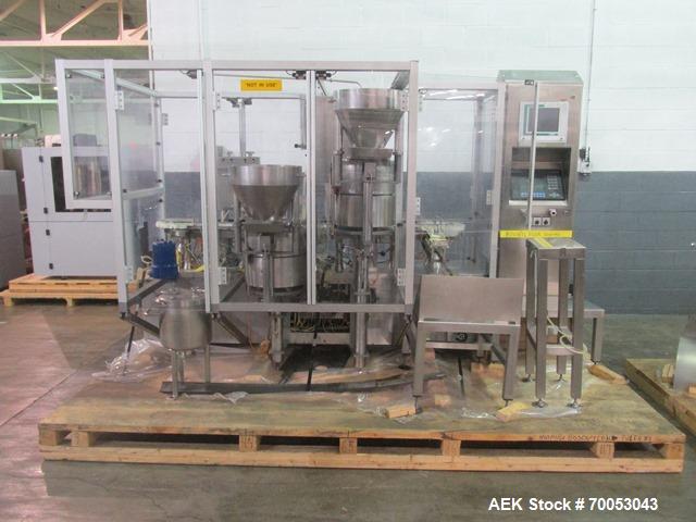 Used Used TL Bosch vial filling line, model MLF3002 filler, with 48" diameter accumulation table, vial air cleaner station, 4 head filling station, stopper inserter and capper stations with bowl feed...