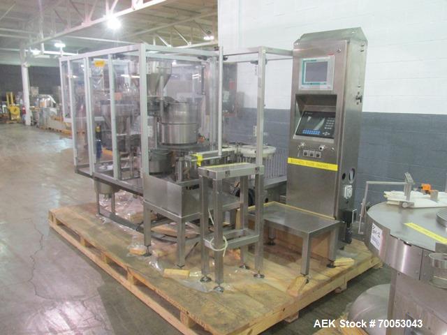 Used Used TL Bosch vial filling line, model MLF3002 filler, with 48" diameter accumulation table, vial air cleaner station, 4 head filling station, stopper inserter and capper stations with bowl feed...