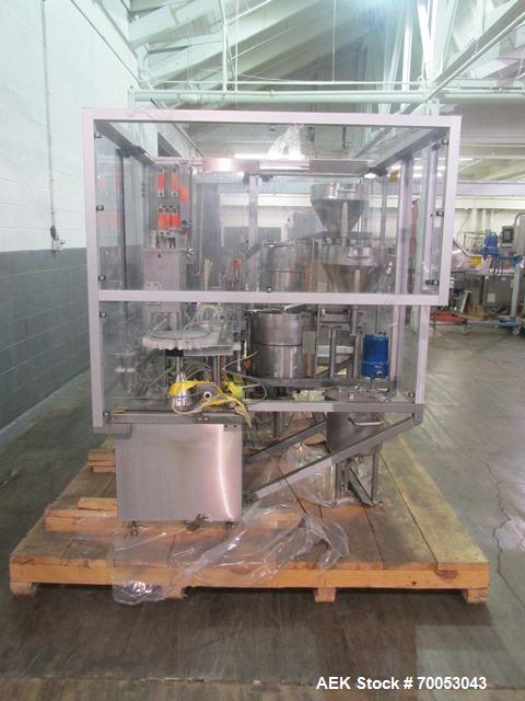 Used Used TL Bosch vial filling line, model MLF3002 filler, with 48" diameter accumulation table, vial air cleaner station, 4 head filling station, stopper inserter and capper stations with bowl feed...