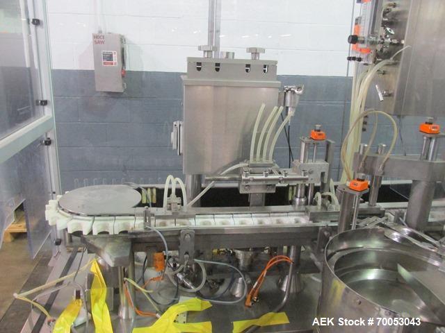Used Used TL Bosch vial filling line, model MLF3002 filler, with 48" diameter accumulation table, vial air cleaner station, 4 head filling station, stopper inserter and capper stations with bowl feed...