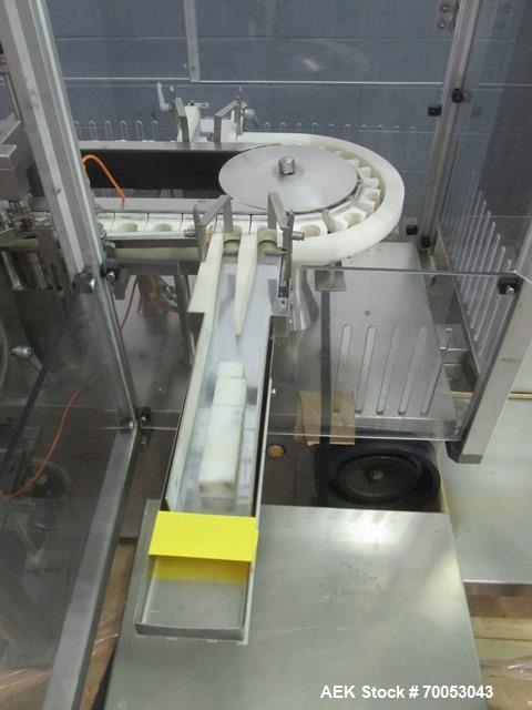Used Used TL Bosch vial filling line, model MLF3002 filler, with 48" diameter accumulation table, vial air cleaner station, 4 head filling station, stopper inserter and capper stations with bowl feed...