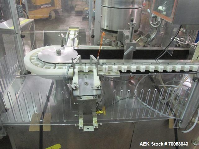 Used Used TL Bosch vial filling line, model MLF3002 filler, with 48" diameter accumulation table, vial air cleaner station, 4 head filling station, stopper inserter and capper stations with bowl feed...