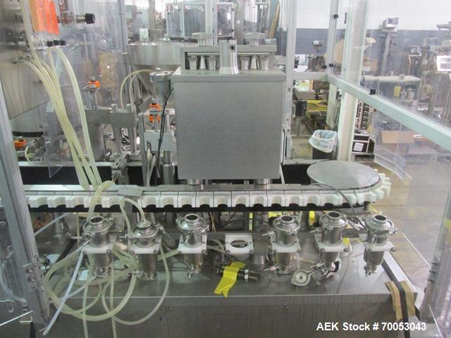 Used Used TL Bosch vial filling line, model MLF3002 filler, with 48" diameter accumulation table, vial air cleaner station, 4 head filling station, stopper inserter and capper stations with bowl feed...