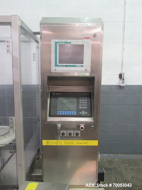 Used Used TL Bosch vial filling line, model MLF3002 filler, with 48" diameter accumulation table, vial air cleaner station, 4 head filling station, stopper inserter and capper stations with bowl feed...