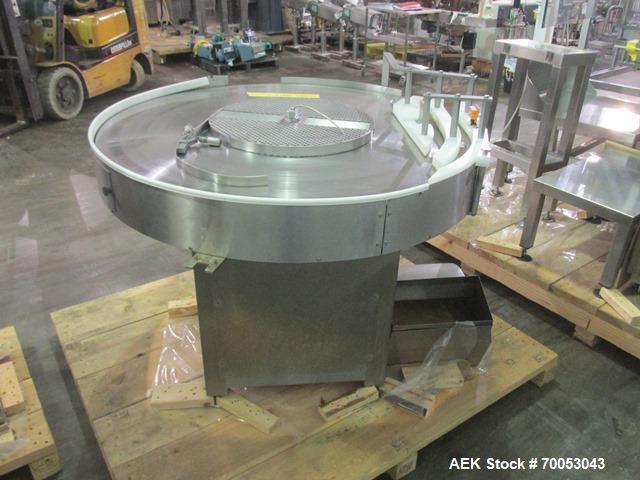 Used Used TL Bosch vial filling line, model MLF3002 filler, with 48" diameter accumulation table, vial air cleaner station, 4 head filling station, stopper inserter and capper stations with bowl feed...