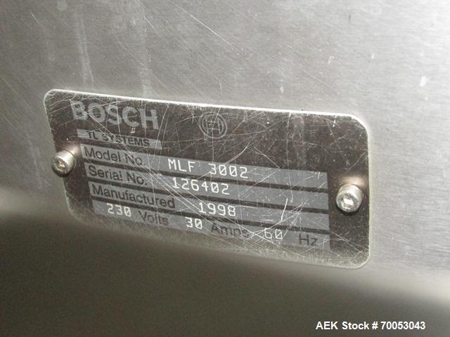 Used Used TL Bosch vial filling line, model MLF3002 filler, with 48" diameter accumulation table, vial air cleaner station, 4 head filling station, stopper inserter and capper stations with bowl feed...