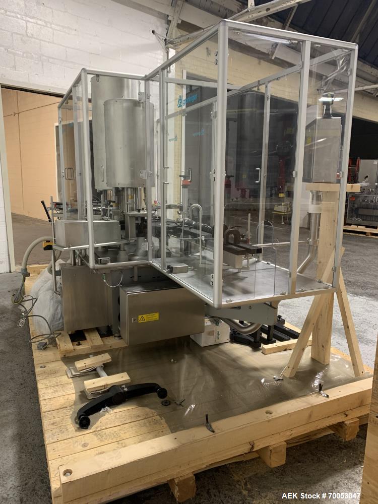 Used Used Groninger inserter capper, Model KVK 206, speeds up to 10000 BPH(166 BPM), with (2) 6 head stations, currently set up with (6) head dropper inserter, and (6) head capper stations, 30 - 230 ...
