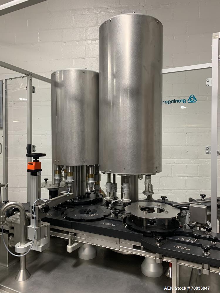 Used Used Groninger inserter capper, Model KVK 206, speeds up to 10000 BPH(166 BPM), with (2) 6 head stations, currently set up with (6) head dropper inserter, and (6) head capper stations, 30 - 230 ...