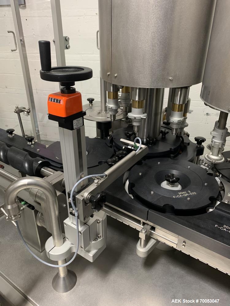 Used Used Groninger inserter capper, Model KVK 206, speeds up to 10000 BPH(166 BPM), with (2) 6 head stations, currently set up with (6) head dropper inserter, and (6) head capper stations, 30 - 230 ...
