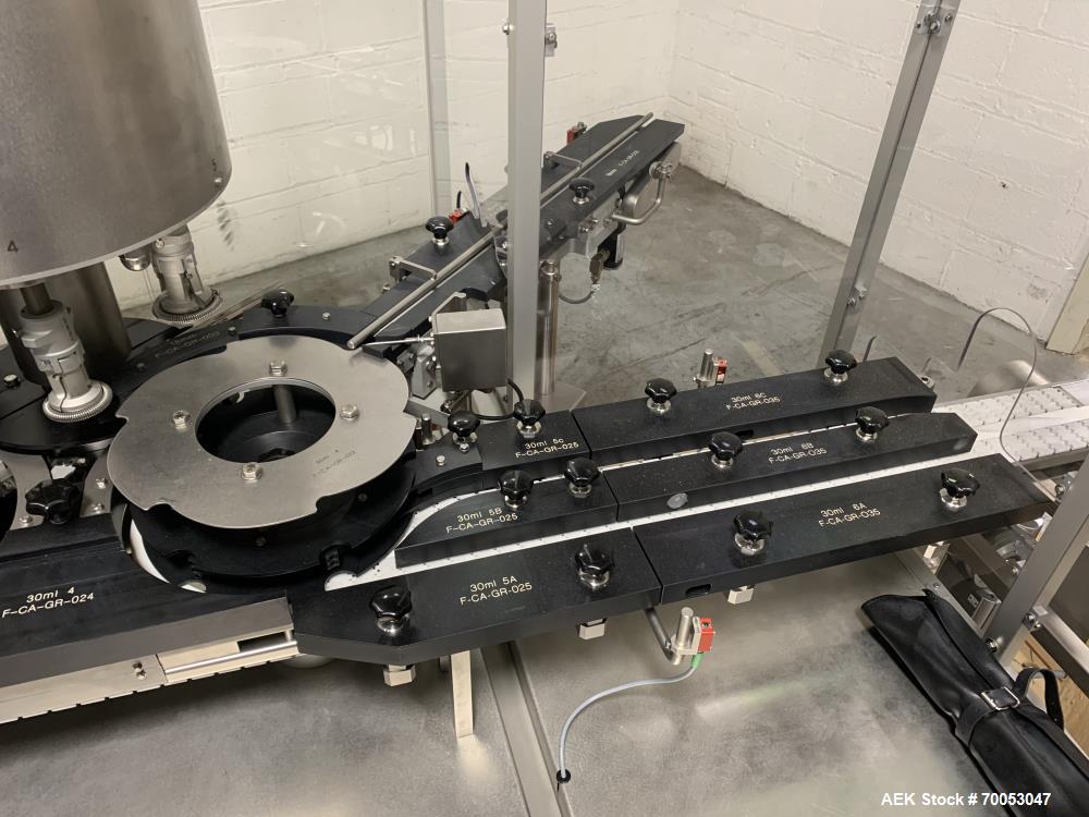 Used Used Groninger inserter capper, Model KVK 206, speeds up to 10000 BPH(166 BPM), with (2) 6 head stations, currently set up with (6) head dropper inserter, and (6) head capper stations, 30 - 230 ...