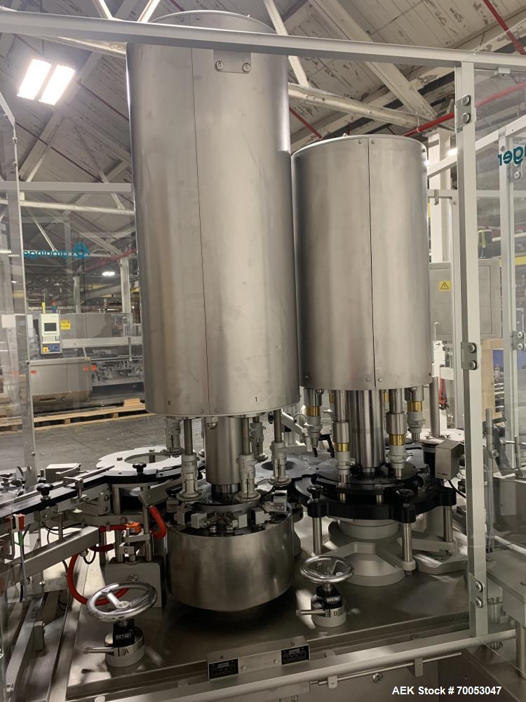 Used Used Groninger inserter capper, Model KVK 206, speeds up to 10000 BPH(166 BPM), with (2) 6 head stations, currently set up with (6) head dropper inserter, and (6) head capper stations, 30 - 230 ...