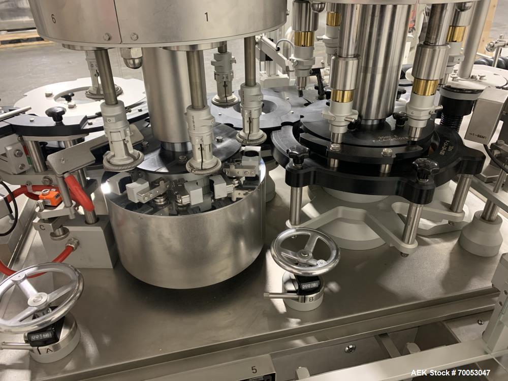 Used Used Groninger inserter capper, Model KVK 206, speeds up to 10000 BPH(166 BPM), with (2) 6 head stations, currently set up with (6) head dropper inserter, and (6) head capper stations, 30 - 230 ...