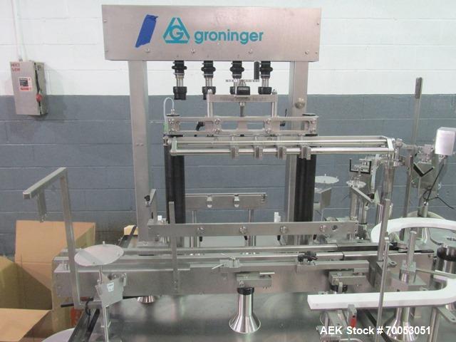 Used Used Groninger filling line, consisting of model KFVG 4211A Groniger filler, plugger, capper, with (4) piston filling station, bowl feeders with plugs and caps, bottle feed station with accumula...