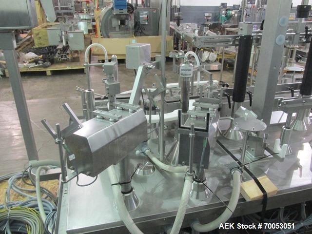 Used Used Groninger filling line, consisting of model KFVG 4211A Groniger filler, plugger, capper, with (4) piston filling station, bowl feeders with plugs and caps, bottle feed station with accumula...