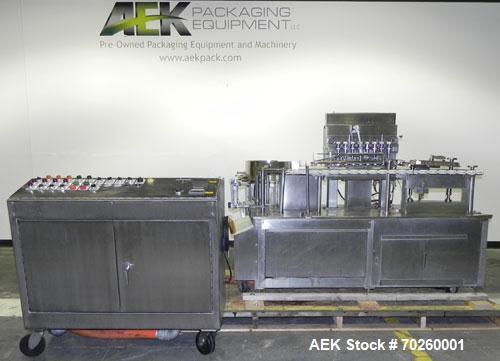Used Bosch TL Systems Monoblock Vial Filler & Stoppering Machine. Consists of an 8 head rolling diaphram type filler, vial indexing system and stopper inserter. Has 8 filling heads with a filling rat...
