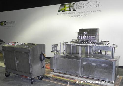 Used Bosch TL Systems Monoblock Vial Filler & Stoppering Machine. Consists of an 8 head rolling diaphram type filler, vial indexing system and stopper inserter. Has 8 filling heads with a filling rat...