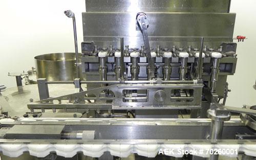 Used Bosch TL Systems Monoblock Vial Filler & Stoppering Machine. Consists of an 8 head rolling diaphram type filler, vial indexing system and stopper inserter. Has 8 filling heads with a filling rat...