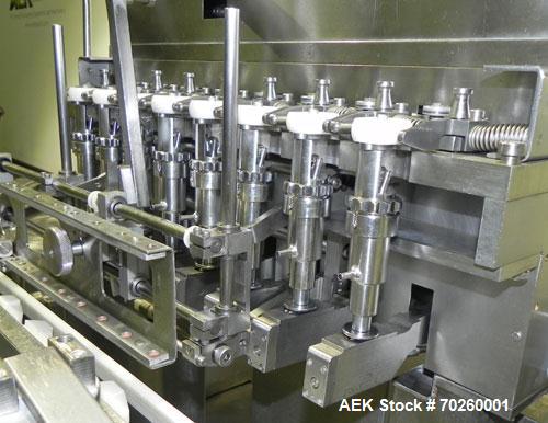 Used Bosch TL Systems Monoblock Vial Filler & Stoppering Machine. Consists of an 8 head rolling diaphram type filler, vial indexing system and stopper inserter. Has 8 filling heads with a filling rat...