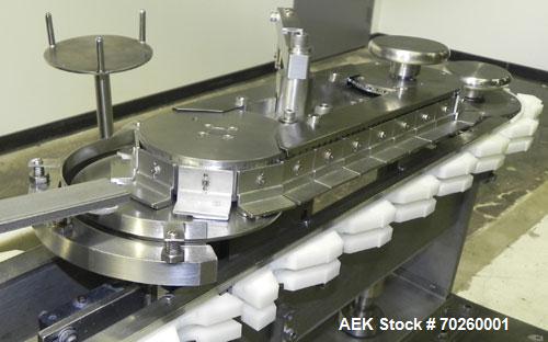 Used Bosch TL Systems Monoblock Vial Filler & Stoppering Machine. Consists of an 8 head rolling diaphram type filler, vial indexing system and stopper inserter. Has 8 filling heads with a filling rat...