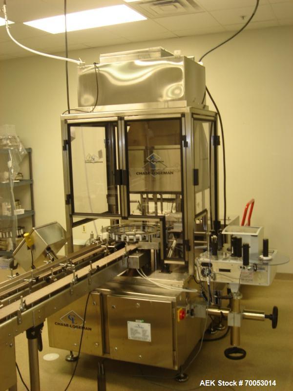 Used Chase Logeman Monoblock Filling Line, Model FPCCL4-12H.  Designed to fill, plug, cap and label at speeds up to 60 containers/minute; fill range from 1 - 125 mL; cap size range from 8 - 32 mm; IM...