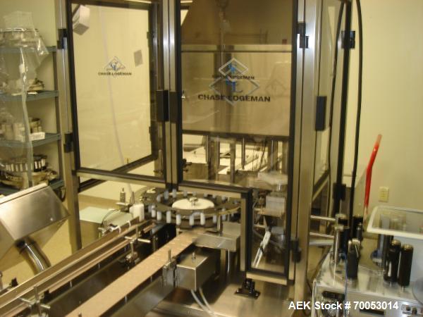 Used Chase Logeman Monoblock Filling Line, Model FPCCL4-12H.  Designed to fill, plug, cap and label at speeds up to 60 containers/minute; fill range from 1 - 125 mL; cap size range from 8 - 32 mm; IM...