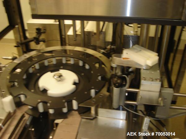 Used Chase Logeman Monoblock Filling Line, Model FPCCL4-12H.  Designed to fill, plug, cap and label at speeds up to 60 containers/minute; fill range from 1 - 125 mL; cap size range from 8 - 32 mm; IM...