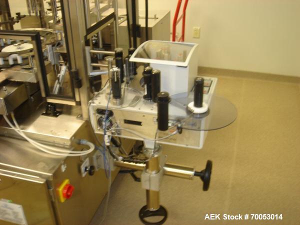 Used Chase Logeman Monoblock Filling Line, Model FPCCL4-12H.  Designed to fill, plug, cap and label at speeds up to 60 containers/minute; fill range from 1 - 125 mL; cap size range from 8 - 32 mm; IM...