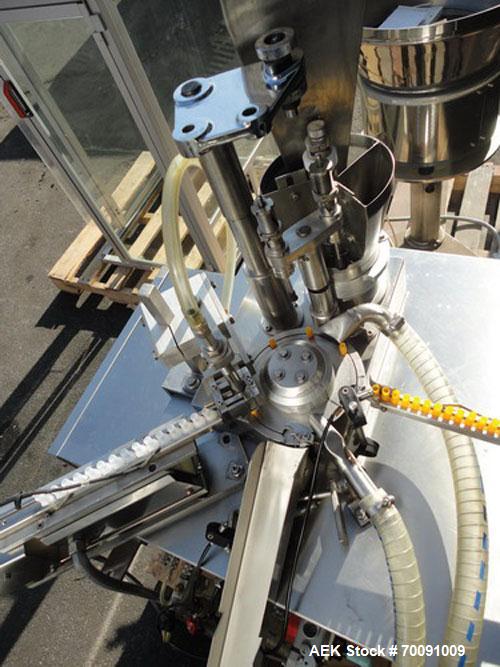 Used Comas Liquid Vial Filler and Capper Monoblock Liquid Filler, Powder Filler RP, Model FC7-50. 3000-4000 parts per hour. This unit has main monoblock with 4 head piston filling mechanism and screw...