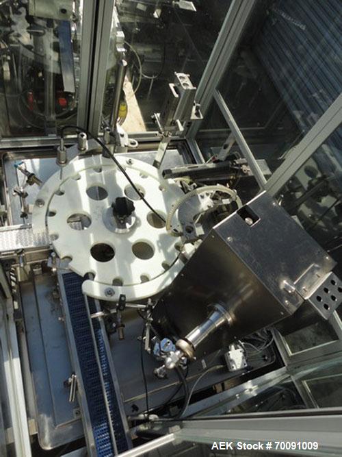 Used Comas Liquid Vial Filler and Capper Monoblock Liquid Filler, Powder Filler RP, Model FC7-50. 3000-4000 parts per hour. This unit has main monoblock with 4 head piston filling mechanism and screw...