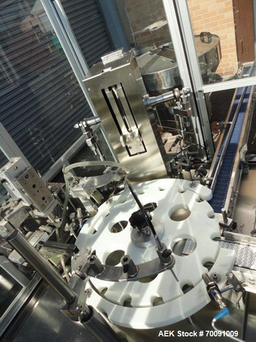 Used Comas Liquid Vial Filler and Capper Monoblock Liquid Filler, Powder Filler RP, Model FC7-50. 3000-4000 parts per hour. This unit has main monoblock with 4 head piston filling mechanism and screw...