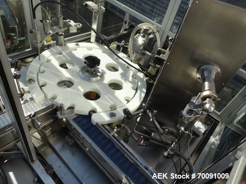 Used Comas Liquid Vial Filler and Capper Monoblock Liquid Filler, Powder Filler RP, Model FC7-50. 3000-4000 parts per hour. This unit has main monoblock with 4 head piston filling mechanism and screw...
