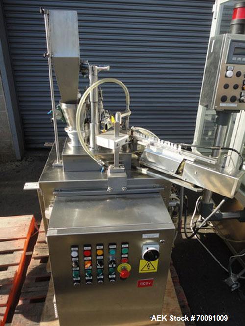 Used Comas Liquid Vial Filler and Capper Monoblock Liquid Filler, Powder Filler RP, Model FC7-50. 3000-4000 parts per hour. This unit has main monoblock with 4 head piston filling mechanism and screw...