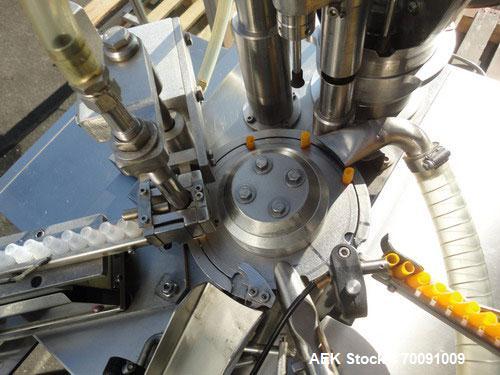 Used Comas Liquid Vial Filler and Capper Monoblock Liquid Filler, Powder Filler RP, Model FC7-50. 3000-4000 parts per hour. This unit has main monoblock with 4 head piston filling mechanism and screw...