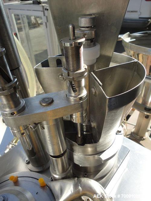Used Comas Liquid Vial Filler and Capper Monoblock Liquid Filler, Powder Filler RP, Model FC7-50. 3000-4000 parts per hour. This unit has main monoblock with 4 head piston filling mechanism and screw...