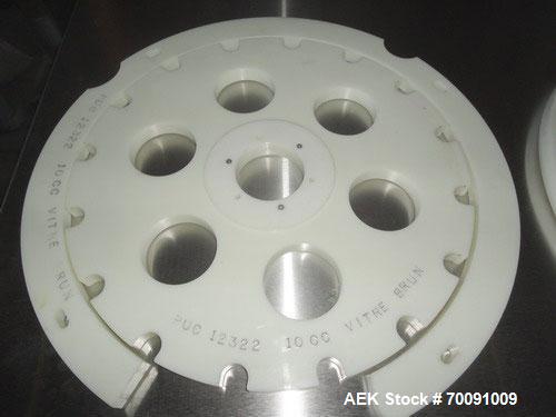 Used Comas Liquid Vial Filler and Capper Monoblock Liquid Filler, Powder Filler RP, Model FC7-50. 3000-4000 parts per hour. This unit has main monoblock with 4 head piston filling mechanism and screw...
