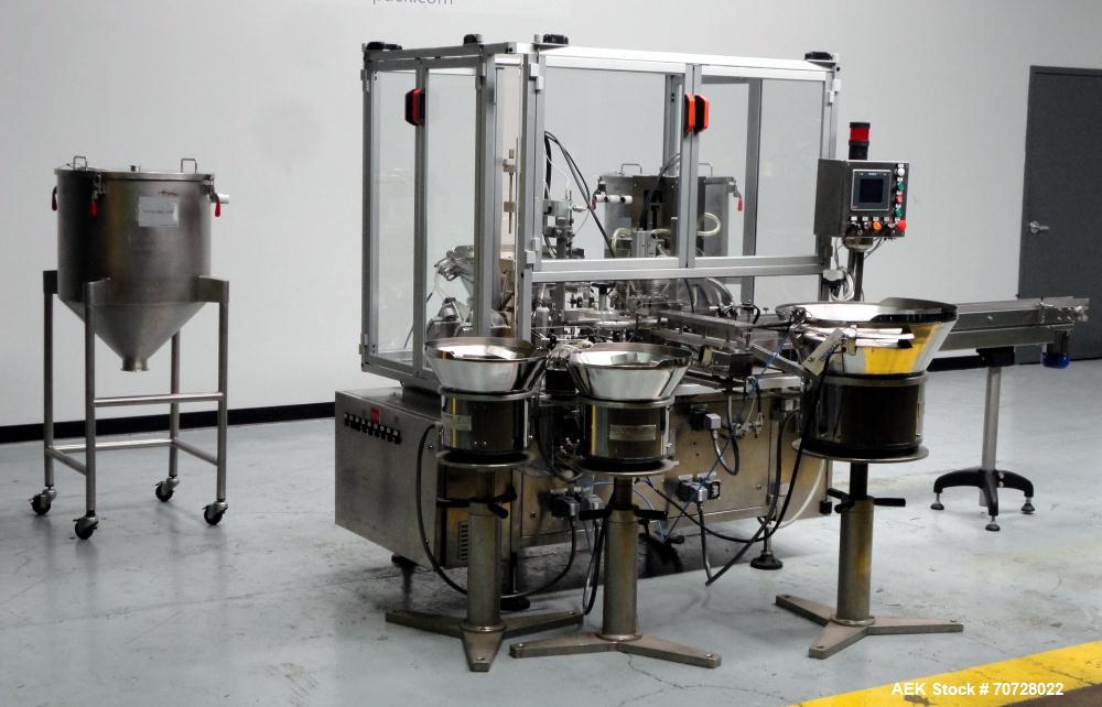 Used Comas Plastic Dispensing Syringe Monoblock Filling System, Model FD120, speeds up to 60 syringes/minute. Dual station index with 2 Ivek Peristaltic product fill pumps, Vibratory Bowl feeders for...