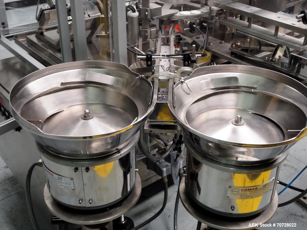 Used Comas Plastic Dispensing Syringe Monoblock Filling System, Model FD120, speeds up to 60 syringes/minute. Dual station index with 2 Ivek Peristaltic product fill pumps, Vibratory Bowl feeders for...