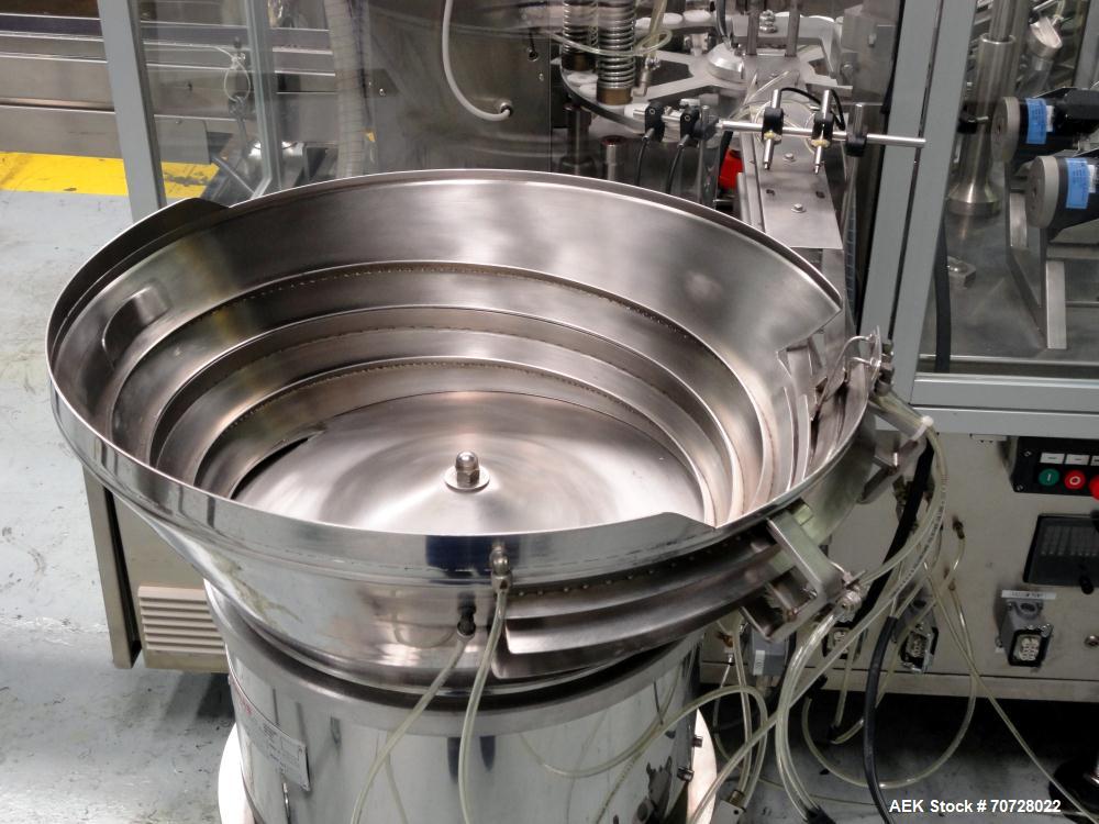 Used Comas Plastic Dispensing Syringe Monoblock Filling System, Model FD120, speeds up to 60 syringes/minute. Dual station index with 2 Ivek Peristaltic product fill pumps, Vibratory Bowl feeders for...