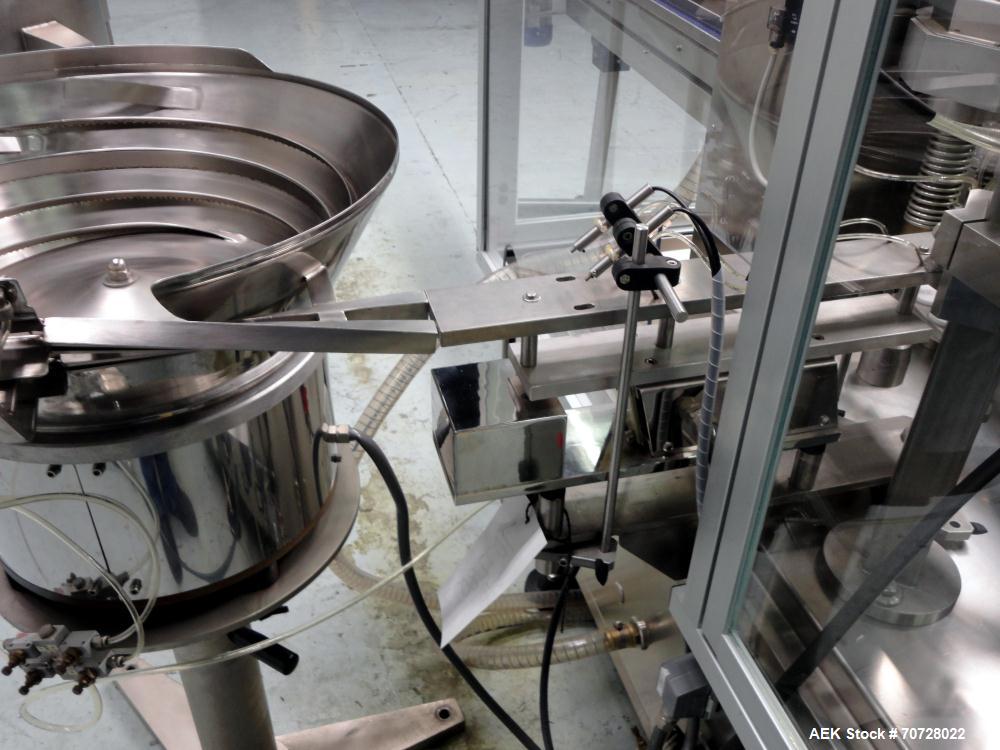 Used Comas Plastic Dispensing Syringe Monoblock Filling System, Model FD120, speeds up to 60 syringes/minute. Dual station index with 2 Ivek Peristaltic product fill pumps, Vibratory Bowl feeders for...