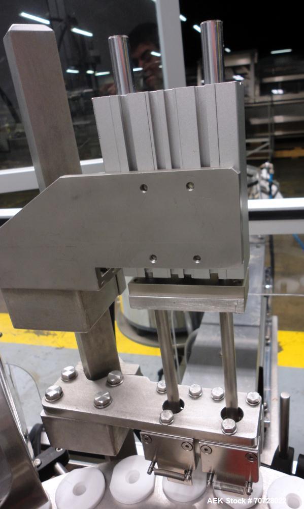Used Comas Plastic Dispensing Syringe Monoblock Filling System, Model FD120, speeds up to 60 syringes/minute. Dual station index with 2 Ivek Peristaltic product fill pumps, Vibratory Bowl feeders for...