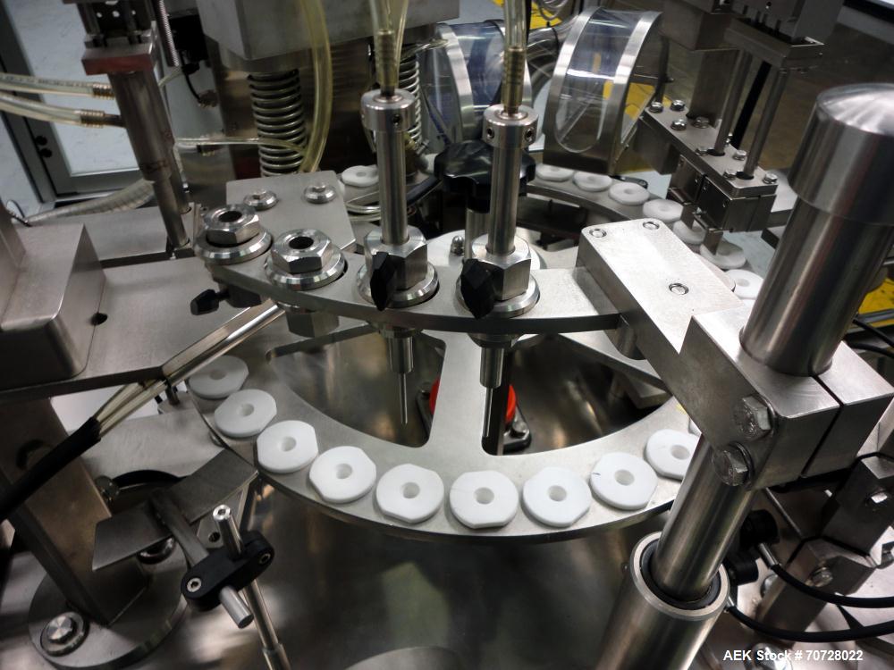 Used Comas Plastic Dispensing Syringe Monoblock Filling System, Model FD120, speeds up to 60 syringes/minute. Dual station index with 2 Ivek Peristaltic product fill pumps, Vibratory Bowl feeders for...