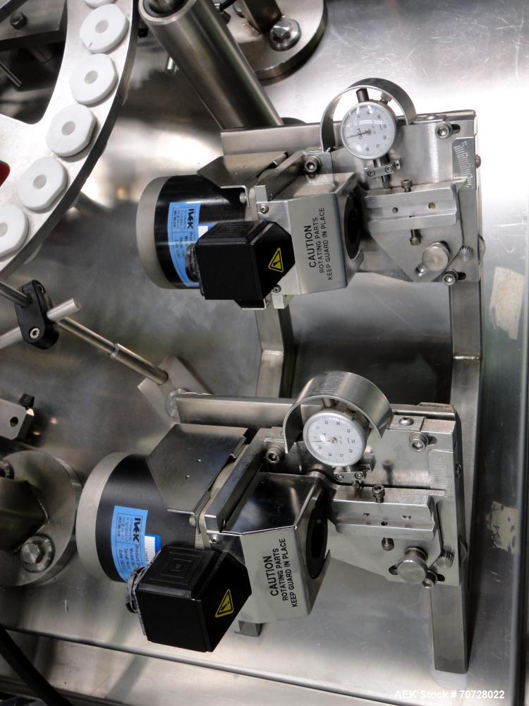 Used Comas Plastic Dispensing Syringe Monoblock Filling System, Model FD120, speeds up to 60 syringes/minute. Dual station index with 2 Ivek Peristaltic product fill pumps, Vibratory Bowl feeders for...