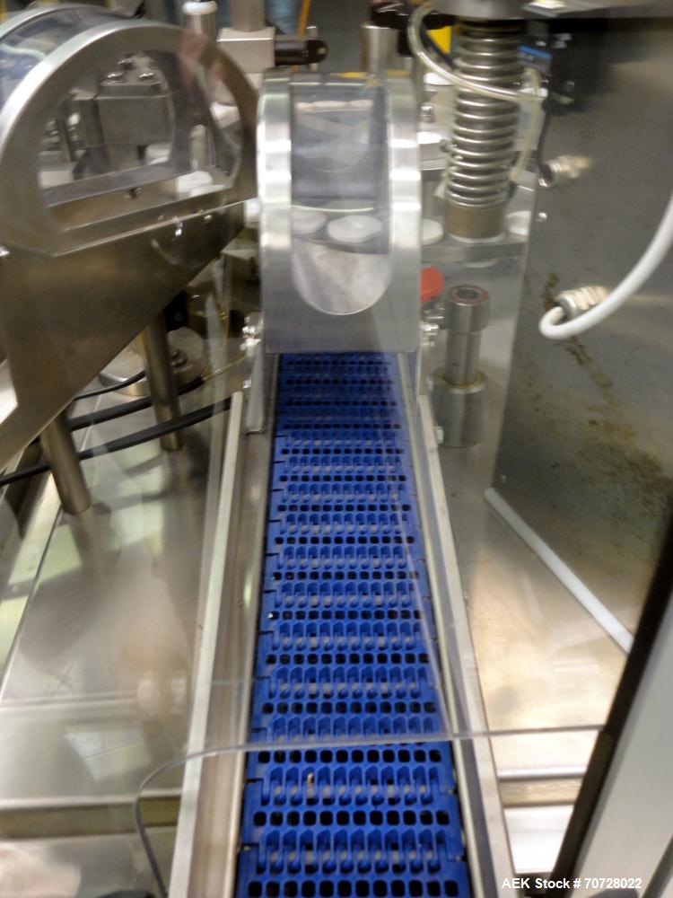 Used Comas Plastic Dispensing Syringe Monoblock Filling System, Model FD120, speeds up to 60 syringes/minute. Dual station index with 2 Ivek Peristaltic product fill pumps, Vibratory Bowl feeders for...