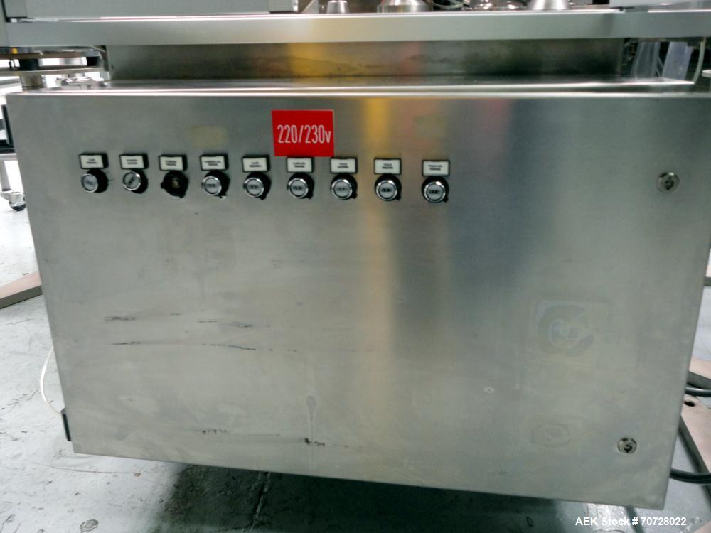 Used Comas Plastic Dispensing Syringe Monoblock Filling System, Model FD120, speeds up to 60 syringes/minute. Dual station index with 2 Ivek Peristaltic product fill pumps, Vibratory Bowl feeders for...