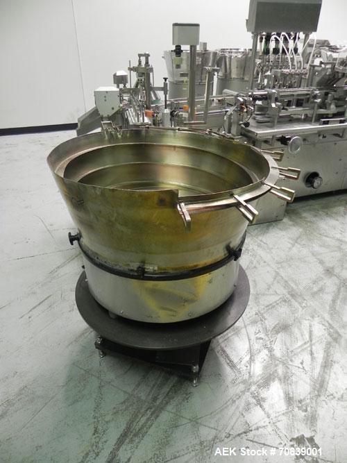 Used Groninger Syringe Filling Line, stainless steel on product contact parts. Line consists of model DFVK4000S inline (4) head filler, RTA3005 filler and HEA100 labeler.