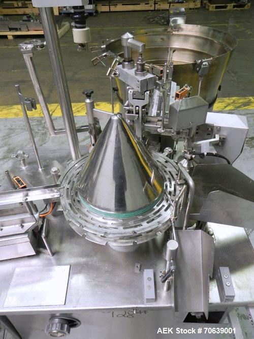 Used Groninger Syringe Filling Line, stainless steel on product contact parts. Line consists of model DFVK4000S inline (4) head filler, RTA3005 filler and HEA100 labeler.