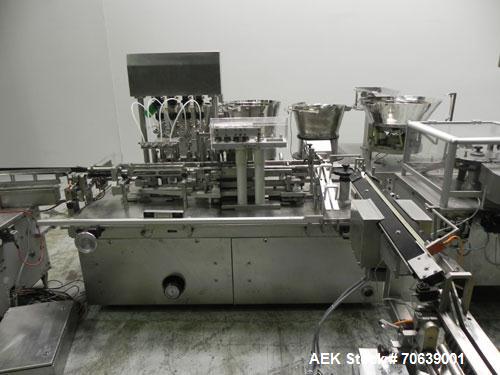 Used Groninger Syringe Filling Line, stainless steel on product contact parts. Line consists of model DFVK4000S inline (4) head filler, RTA3005 filler and HEA100 labeler.