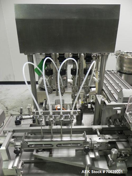 Used Groninger Syringe Filling Line, stainless steel on product contact parts. Line consists of model DFVK4000S inline (4) head filler, RTA3005 filler and HEA100 labeler.